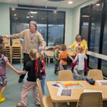 teachers and children dance at the Huntington Children's Museum